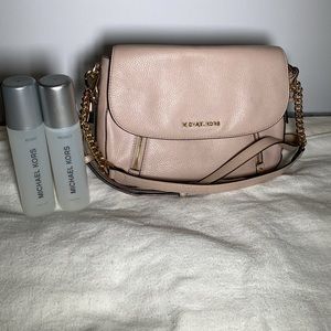 Pink Michael Kors Crossbody / Purse with leather protectant spray